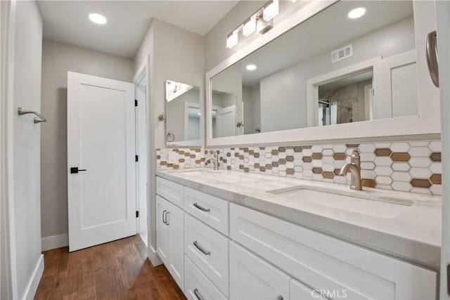 5025 Stonehaven Dr, Yorba Linda, CA 92887 - full bathroom with double vanity, backsplash, wood finished floors, recessed lighting, and a shower
