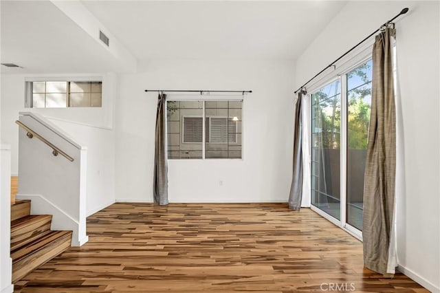 4600 Don Lorenzo Dr Unit 20, Los Angeles, CA 90008 - empty room with wood finished floors and stairs