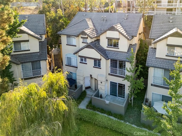 4600 Don Lorenzo Dr Unit 20, Los Angeles, CA 90008 - back of house featuring stucco siding and a balcony