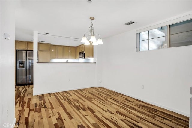 4600 Don Lorenzo Dr Unit 20, Los Angeles, CA 90008 - unfurnished dining area featuring light wood finished floors and a chandelier