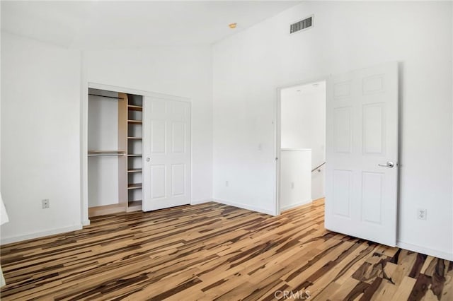 4600 Don Lorenzo Dr Unit 20, Los Angeles, CA 90008 - unfurnished bedroom featuring wood finished floors, a closet, and high vaulted ceiling