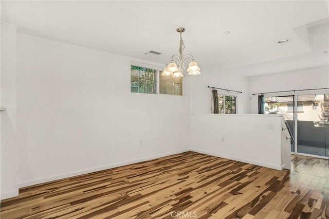 4600 Don Lorenzo Dr Unit 20, Los Angeles, CA 90008 - spare room with a chandelier, wood finished floors, and recessed lighting