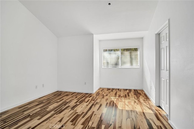 4600 Don Lorenzo Dr Unit 20, Los Angeles, CA 90008 - unfurnished bedroom featuring wood finished floors and vaulted ceiling