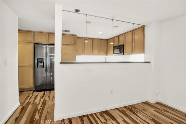 4600 Don Lorenzo Dr Unit 20, Los Angeles, CA 90008 - kitchen with stainless steel fridge with ice dispenser, black microwave, wood finished floors, and decorative light fixtures