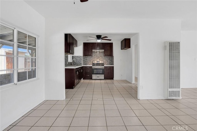 5327 N Rockvale Ave, Azusa, CA 91702 - kitchen featuring stainless steel stove, a heating unit, ceiling fan, decorative backsplash, and light countertops