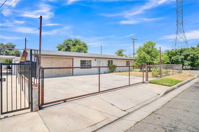 5327 N Rockvale Ave, Azusa, CA 91702 - view of front of home featuring a gate, stucco siding, and a fenced front yard