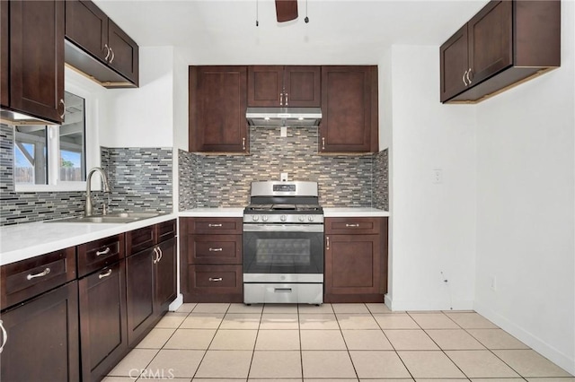 5327 N Rockvale Ave, Azusa, CA 91702 - kitchen with stainless steel gas stove, under cabinet range hood, light countertops, and tasteful backsplash