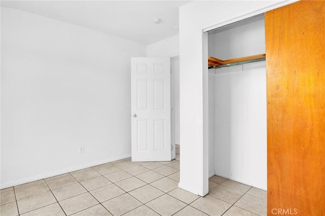 5327 N Rockvale Ave, Azusa, CA 91702 - unfurnished bedroom with light tile patterned floors and a closet