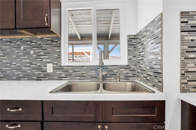 5327 N Rockvale Ave, Azusa, CA 91702 - kitchen with dark brown cabinets, light countertops, and backsplash