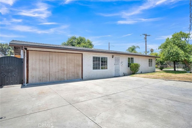5327 N Rockvale Ave, Azusa, CA 91702 - single story home featuring driveway, stucco siding, a garage, and a gate