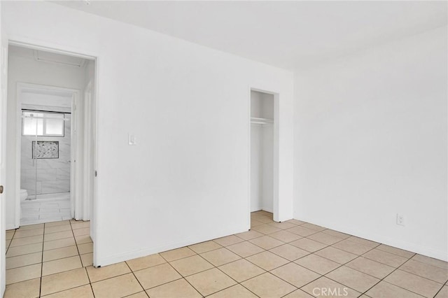 5327 N Rockvale Ave, Azusa, CA 91702 - unfurnished bedroom featuring light tile patterned flooring and a closet
