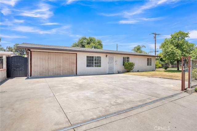5327 N Rockvale Ave, Azusa, CA 91702 - ranch-style house with a gate, concrete driveway, and stucco siding