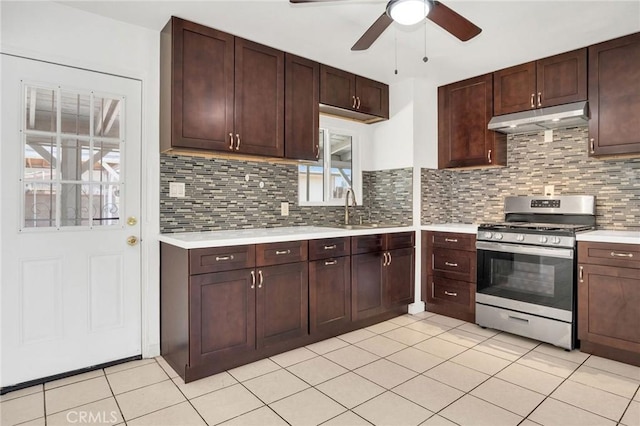 5327 N Rockvale Ave, Azusa, CA 91702 - kitchen featuring stainless steel gas range oven, under cabinet range hood, light countertops, ceiling fan, and light tile patterned floors