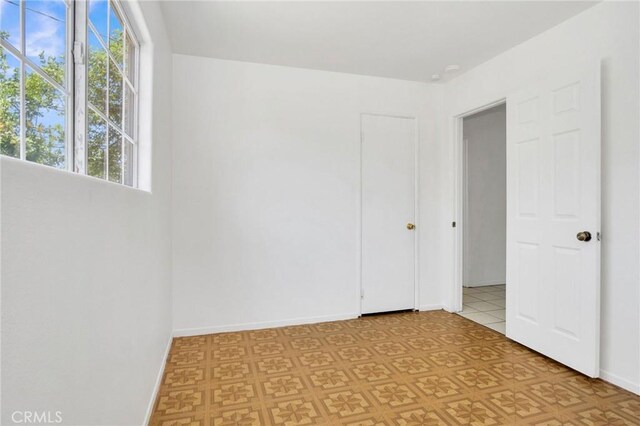 5327 N Rockvale Ave, Azusa, CA 91702 - empty room featuring healthy amount of natural light