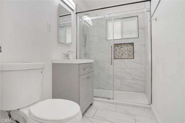 5327 N Rockvale Ave, Azusa, CA 91702 - full bathroom featuring marble finish floors, a stall shower, and vanity