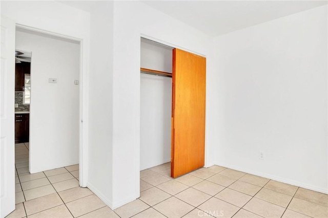 5327 N Rockvale Ave, Azusa, CA 91702 - unfurnished bedroom with light tile patterned flooring and a closet