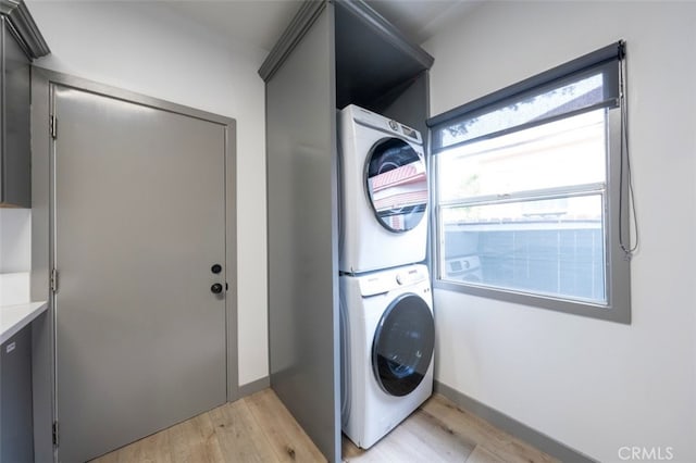 532 W 5th St, Long Beach, CA 90802 - washroom featuring stacked washing machine and dryer and light wood-type flooring