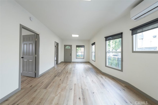 532 W 5th St, Long Beach, CA 90802 - spare room featuring a wall mounted AC and light wood finished floors