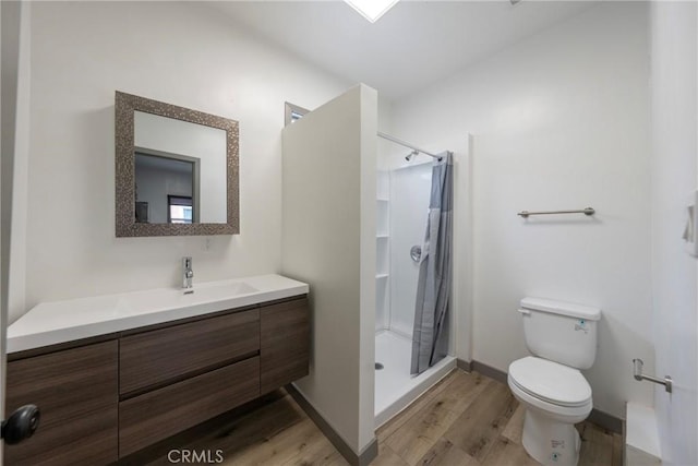 532 W 5th St, Long Beach, CA 90802 - full bath with wood finished floors, vanity, and a stall shower