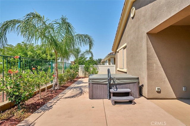 1660 Snowberry Rd, Beaumont, CA 92223 - fenced backyard with a hot tub and a patio