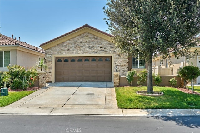 1660 Snowberry Rd, Beaumont, CA 92223 - view of front of house featuring stone siding, a garage, driveway, stucco siding, and a front lawn