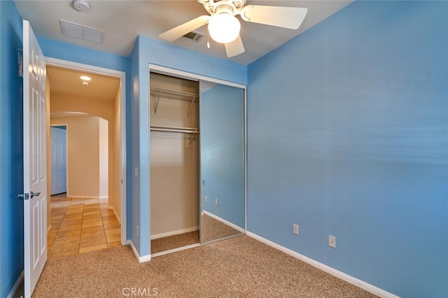 1660 Snowberry Rd, Beaumont, CA 92223 - unfurnished bedroom with arched walkways, light colored carpet, a closet, and ceiling fan