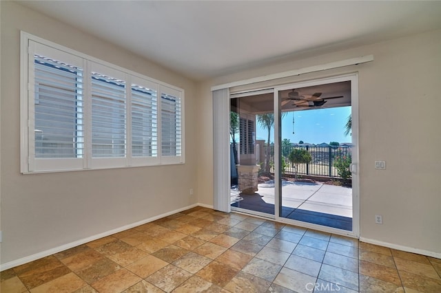 1660 Snowberry Rd, Beaumont, CA 92223 - unfurnished room with stone tile flooring and ceiling fan