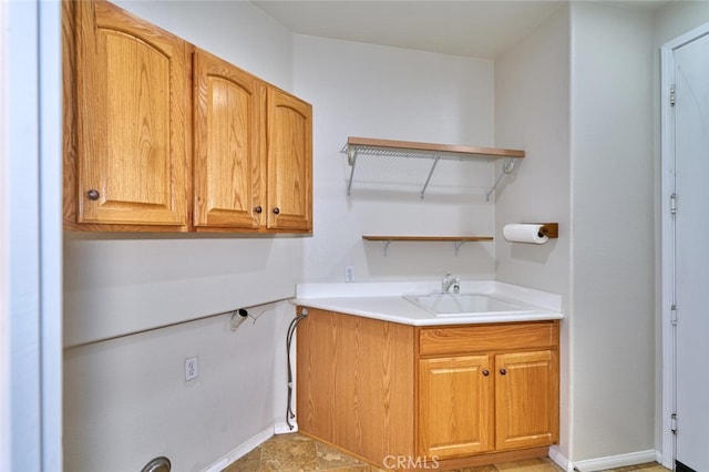1660 Snowberry Rd, Beaumont, CA 92223 - washroom with cabinet space and baseboards