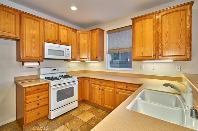 1660 Snowberry Rd, Beaumont, CA 92223 - kitchen with white appliances, light countertops, recessed lighting, and brown cabinets