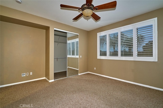 1660 Snowberry Rd, Beaumont, CA 92223 - unfurnished bedroom featuring carpet floors, multiple windows, a closet, and a ceiling fan