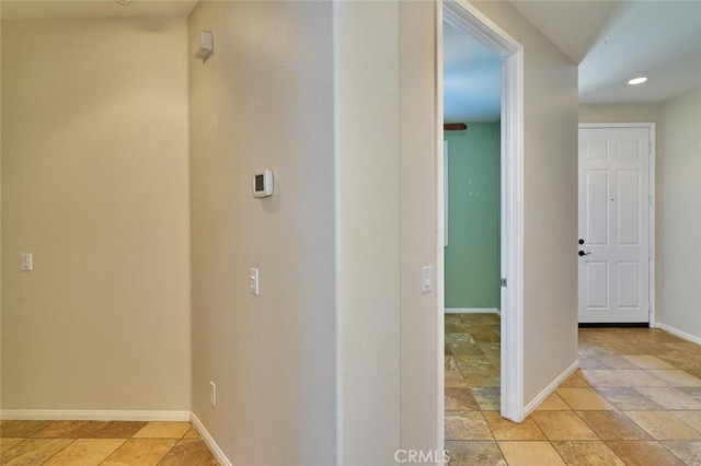 1660 Snowberry Rd, Beaumont, CA 92223 - hall with recessed lighting and light stone finish flooring
