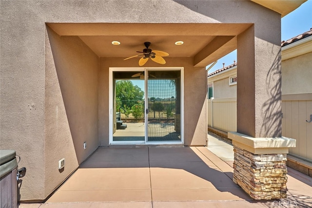 1660 Snowberry Rd, Beaumont, CA 92223 - view of exterior entry with a patio, a ceiling fan, and stucco siding