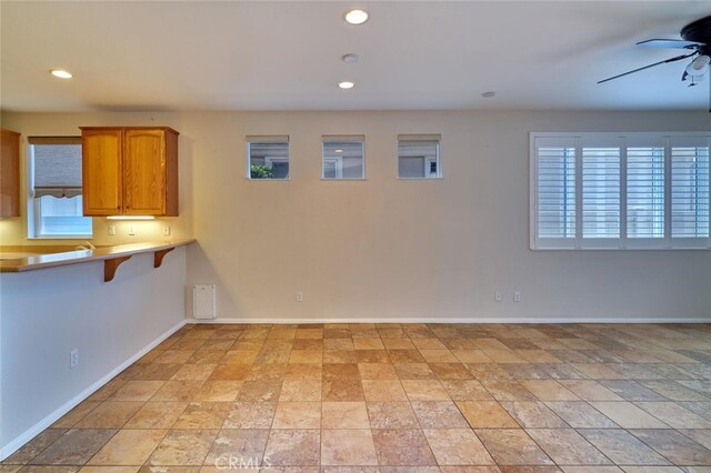1660 Snowberry Rd, Beaumont, CA 92223 - unfurnished dining area with ceiling fan, recessed lighting, and light stone finish flooring