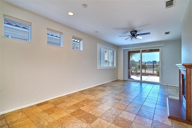 1660 Snowberry Rd, Beaumont, CA 92223 - unfurnished living room with a ceiling fan, a fireplace with raised hearth, and recessed lighting