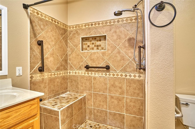 1660 Snowberry Rd, Beaumont, CA 92223 - bathroom featuring tiled shower, a textured wall, and vanity