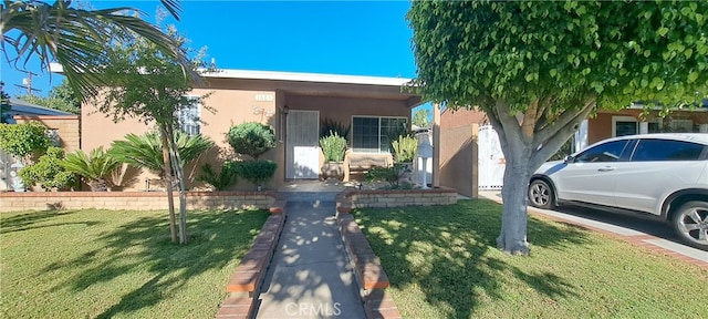 1605 S Birch St, Santa Ana, CA 92707 - view of front of house featuring stucco siding and a front yard