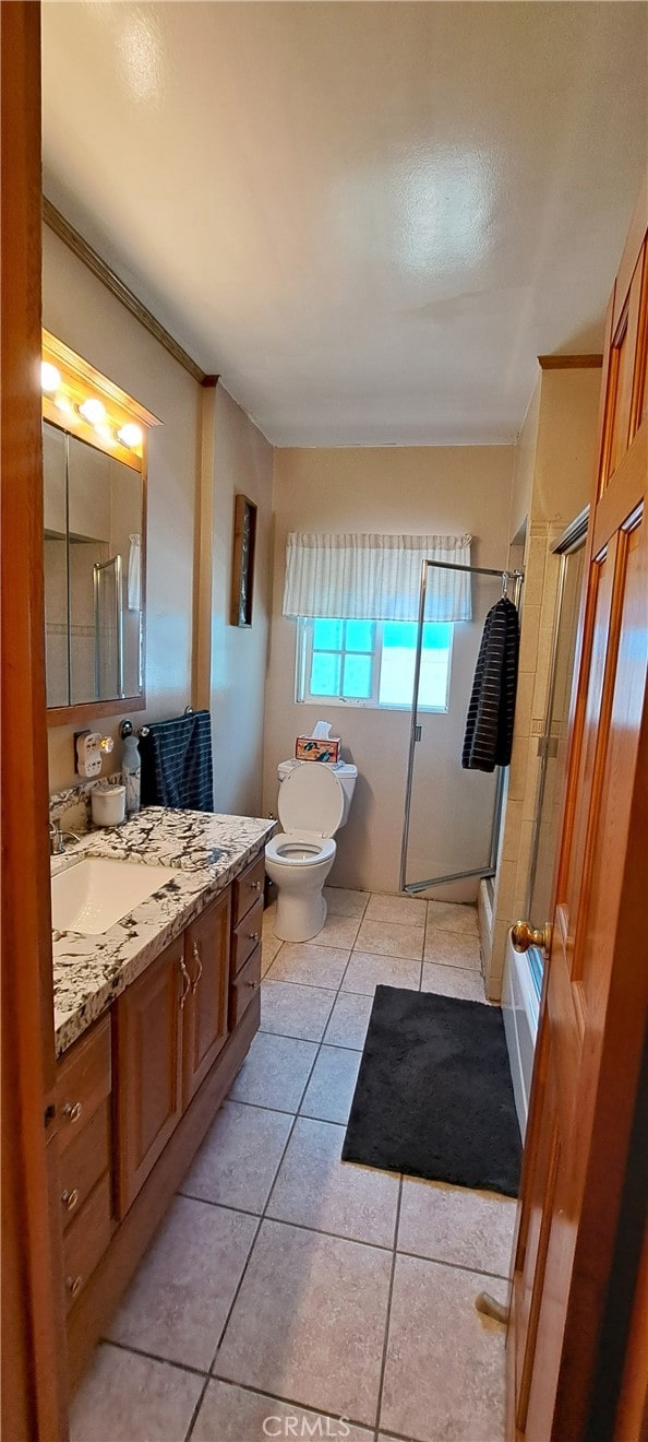 1605 S Birch St, Santa Ana, CA 92707 - full bathroom with vanity, a stall shower, and tile patterned floors