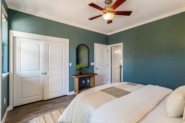 3591 Sacramento Dr Unit 208, San Luis Obispo, CA 93401 - bedroom with wood finished floors, crown molding, a closet, and a ceiling fan