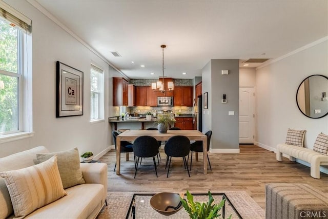 3591 Sacramento Dr Unit 208, San Luis Obispo, CA 93401 - living area with light wood finished floors, crown molding, a chandelier, and recessed lighting