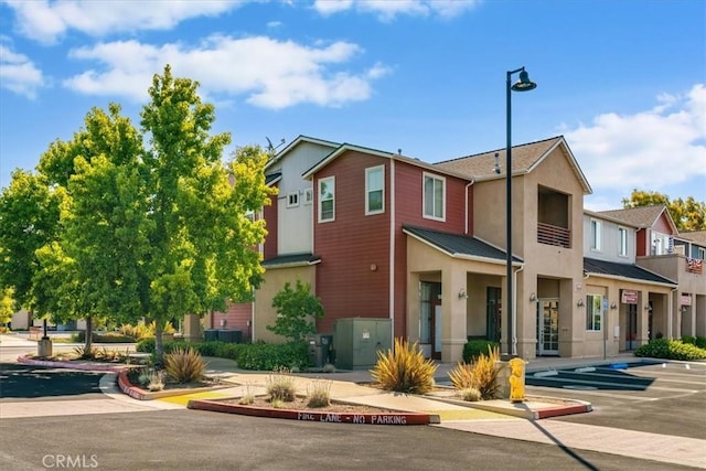 3591 Sacramento Dr Unit 208, San Luis Obispo, CA 93401 - view of building exterior with a residential view and uncovered parking