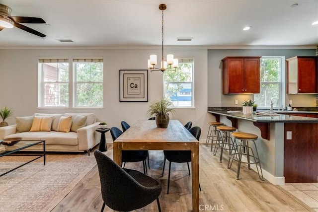 3591 Sacramento Dr Unit 208, San Luis Obispo, CA 93401 - dining area with crown molding, a chandelier, light wood-type flooring, a ceiling fan, and recessed lighting
