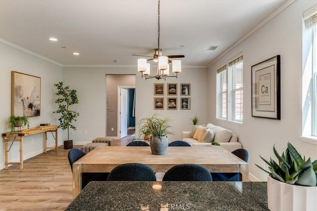 3591 Sacramento Dr Unit 208, San Luis Obispo, CA 93401 - dining area featuring light wood-style flooring, healthy amount of natural light, a chandelier, crown molding, and recessed lighting