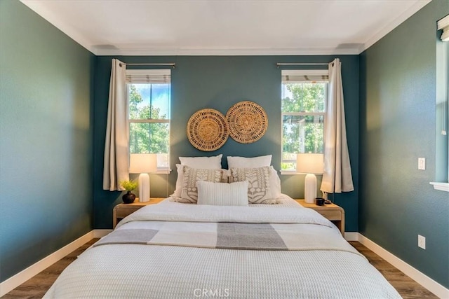 3591 Sacramento Dr Unit 208, San Luis Obispo, CA 93401 - bedroom with wood finished floors and ornamental molding
