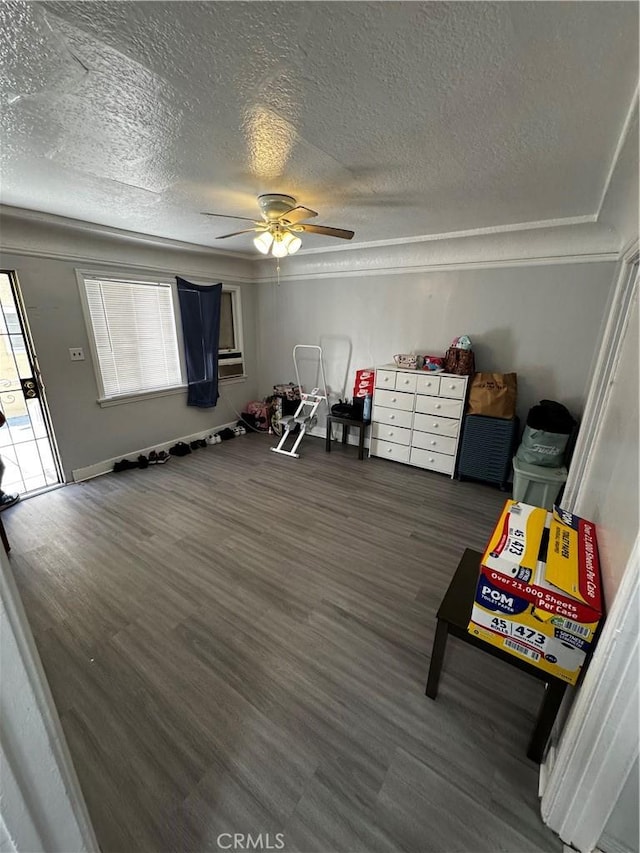 8648 Chestnut Ave, South Gate, CA 90280 - recreation room featuring ceiling fan, a textured ceiling, wood finished floors, and ornamental molding
