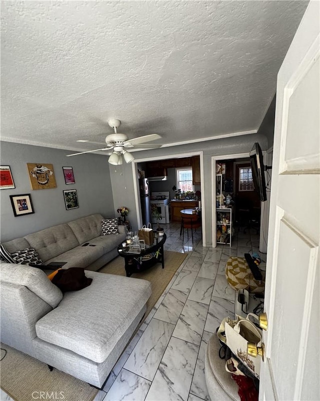 8648 Chestnut Ave, South Gate, CA 90280 - living area featuring light marble finish flooring and ceiling fan