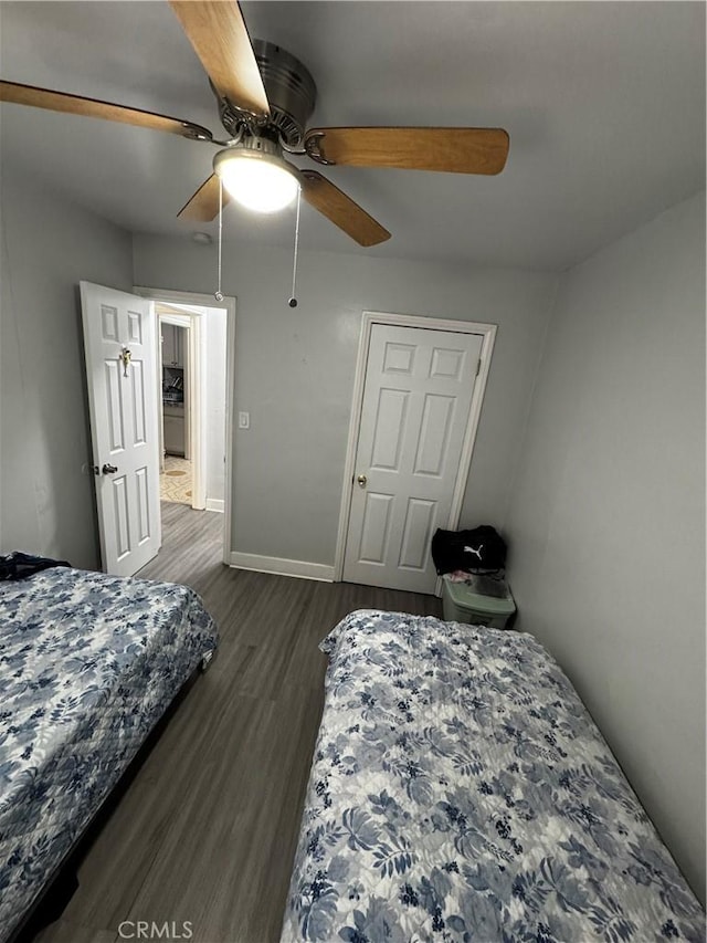 8648 Chestnut Ave, South Gate, CA 90280 - bedroom with dark wood finished floors and ceiling fan