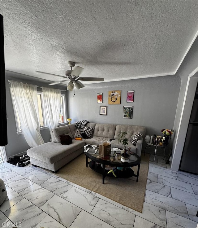 8648 Chestnut Ave, South Gate, CA 90280 - living room featuring light marble finish flooring, ceiling fan, and a textured ceiling