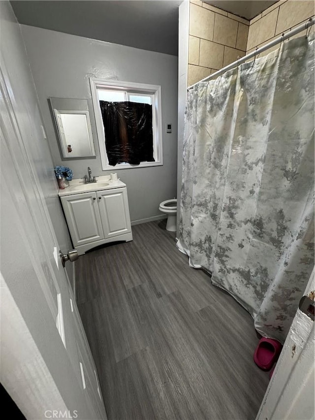 8648 Chestnut Ave, South Gate, CA 90280 - full bath with vanity, wood finished floors, and a shower with curtain