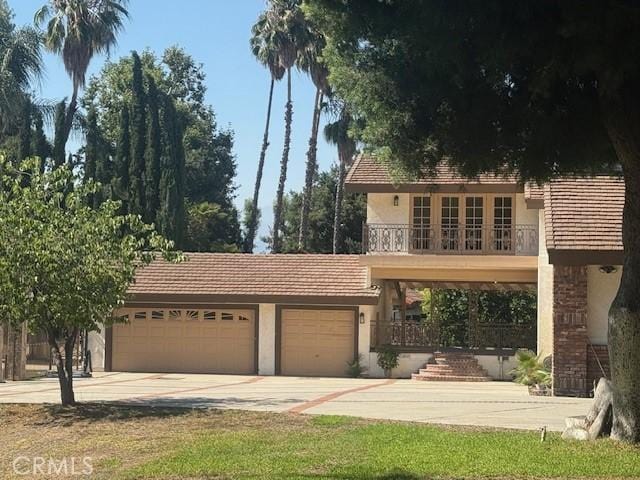 3535 E Cortez, West Covina, CA 91791 - view of front facade featuring stucco siding, driveway, and a garage