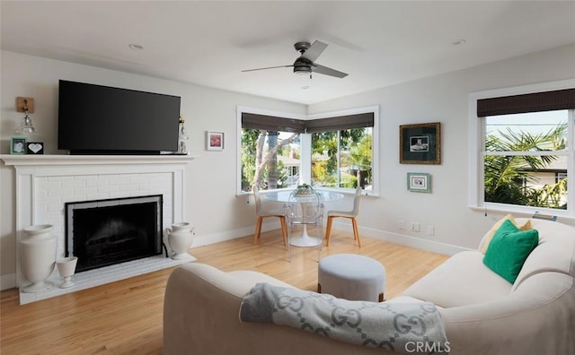 31907 9th Ave, Laguna Beach, CA 92651 - living area with ceiling fan, wood finished floors, and a fireplace